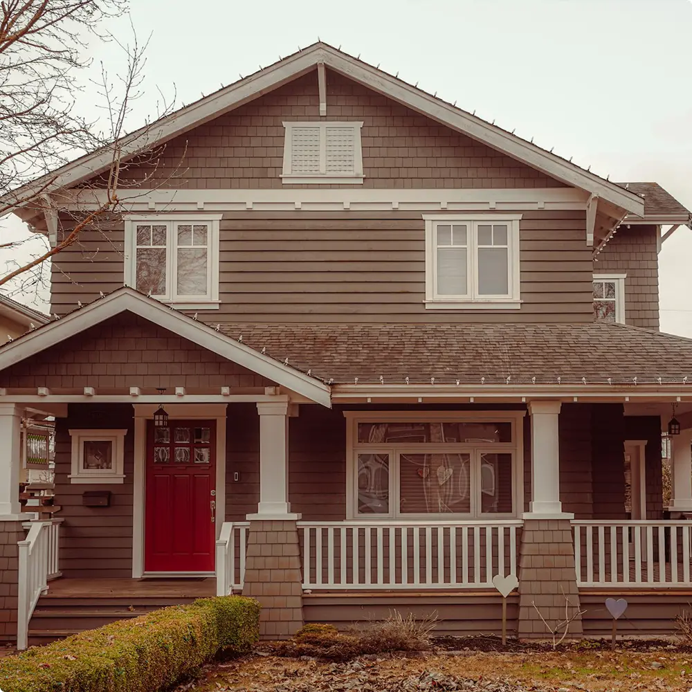 Brown House with Bold Red Door