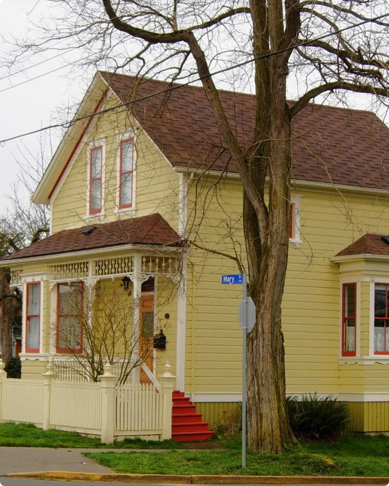 Brown Roof Soft Yellow Color House