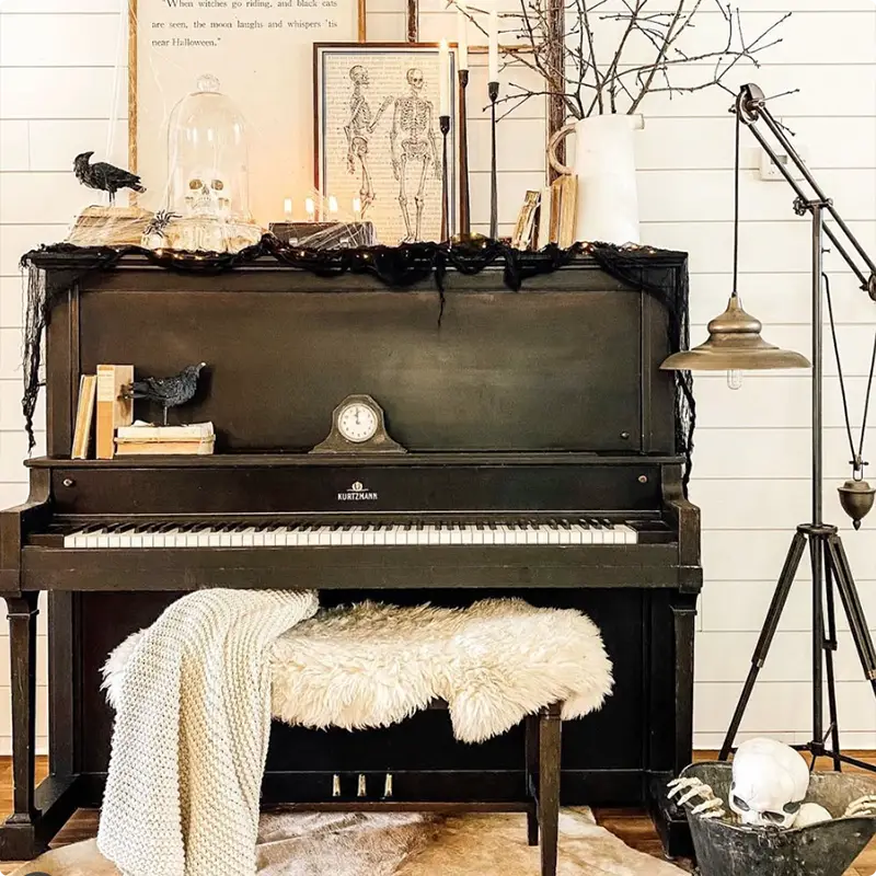 Create a Spooky Scene With Skeletons and Candles on a Vintage Piano