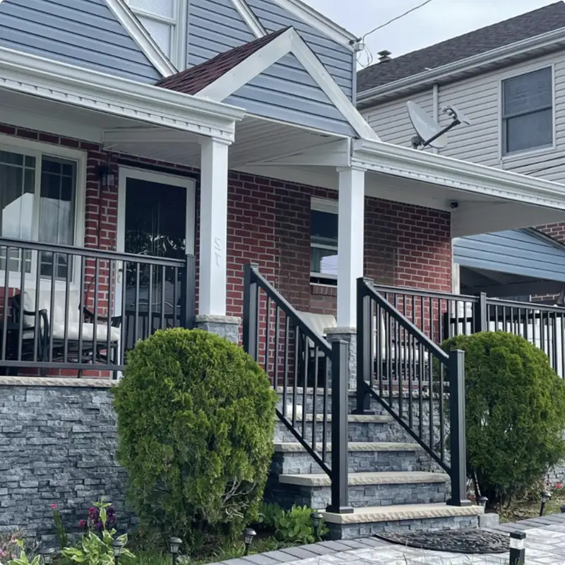 Bold Black Railing Set Against Striking Red Brick Walls