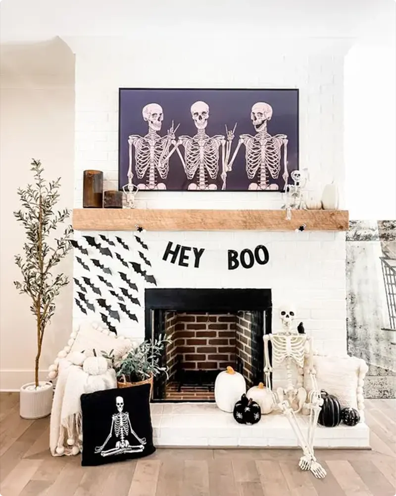 Chic Black and White Halloween Mantel with Bats and Skeleton Accents