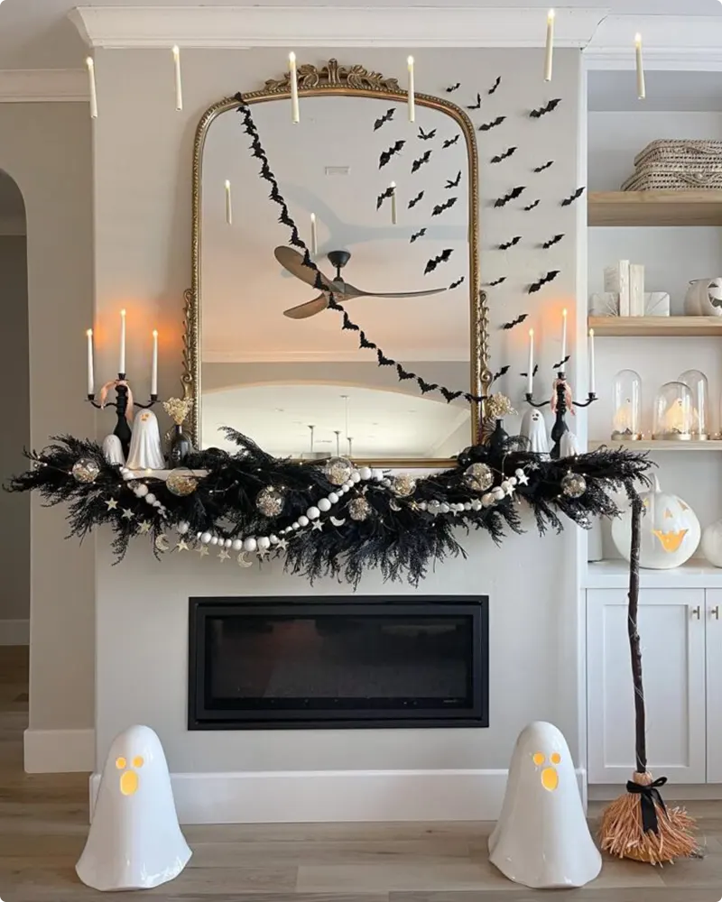 Floating Candles and Bat Cascade on a Chic Halloween Mantel