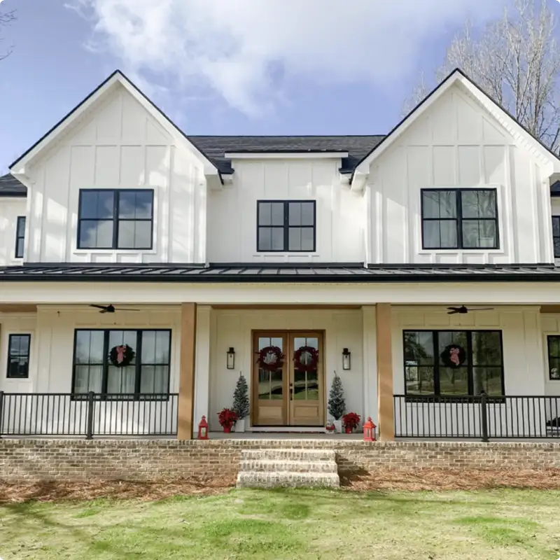 Rustic Charm With a Small Porch and Black Handrail
