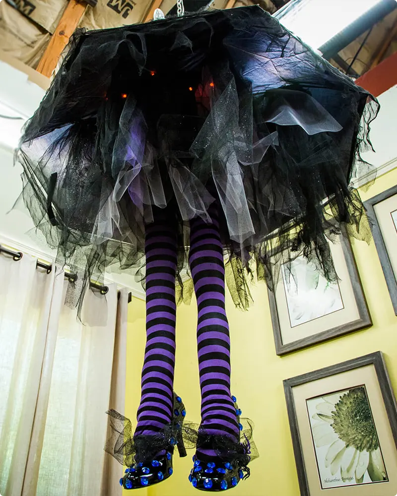 Whimsical Witch Leg Chandelier for a Playful Halloween Touch