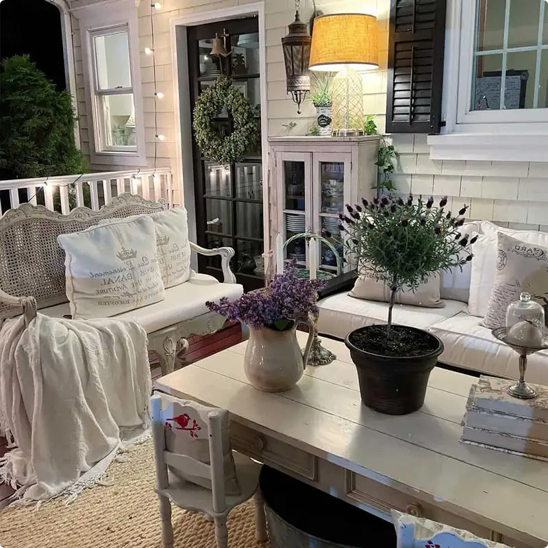 White Porch Railing Glowing Under Soft String Lights