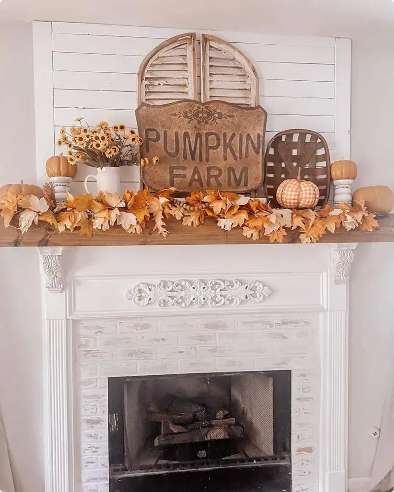 Whitewashed Brick Fireplace with Vintage Pumpkin Accents