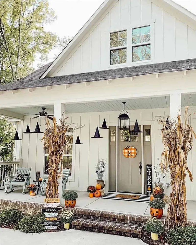 Adorable Halloween Porch with Whimsical Witch Decor