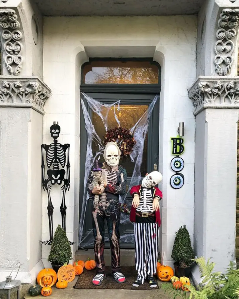 Spooky Skeleton Doorway with Dressed-Up Figures